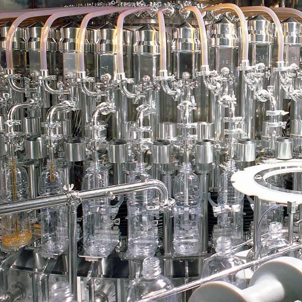 A machine assembly line filling bottles.