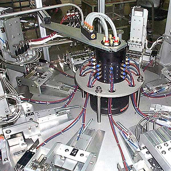 A complex machine assembling dental tools for dentists.